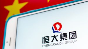 chinas real estate giant evergrande narrowly dodges default for the third time in 30 days